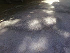 Una delle buche asfaltate al cimitero delle Grazie